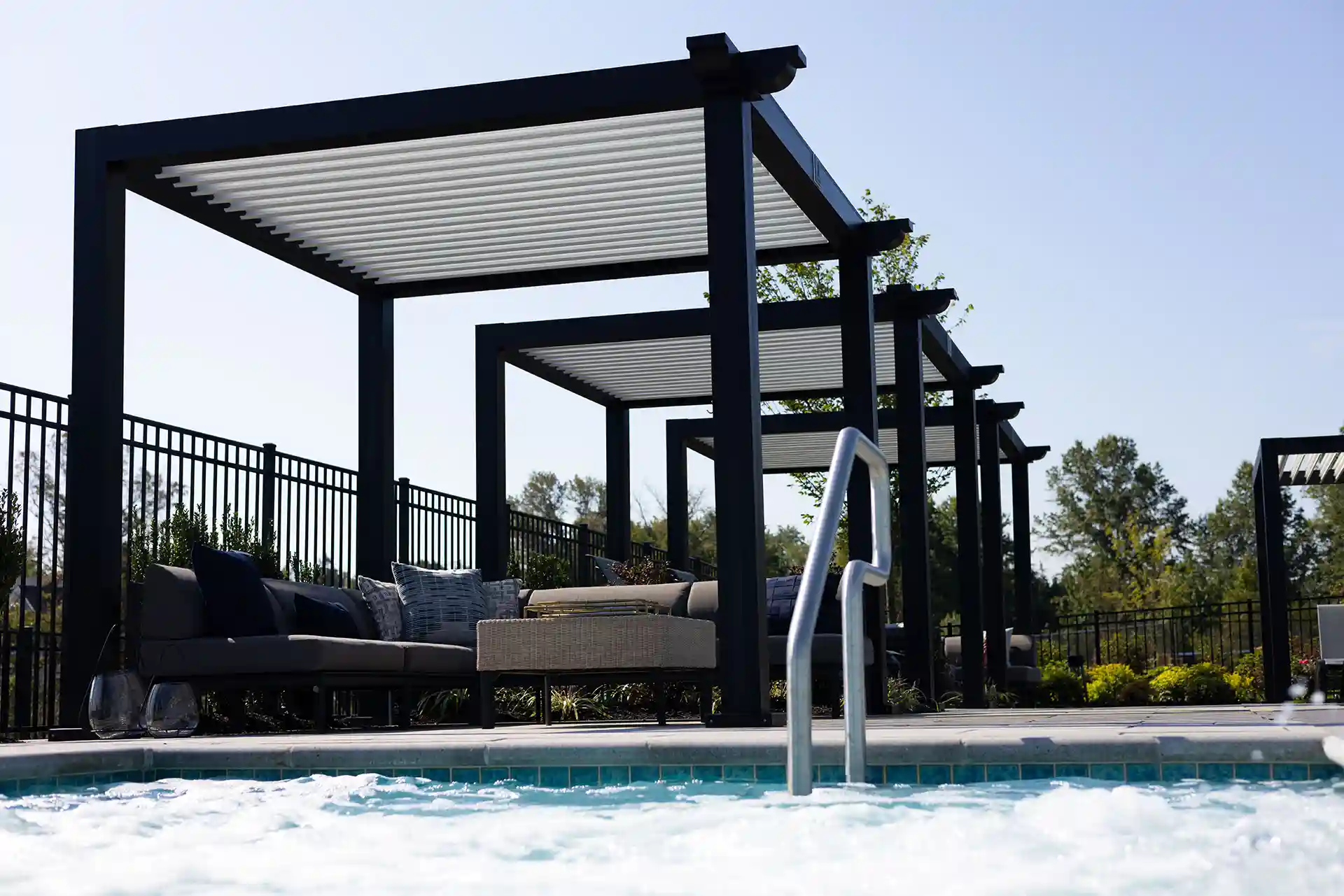 Photo of a poolside StruXure Cabanas.