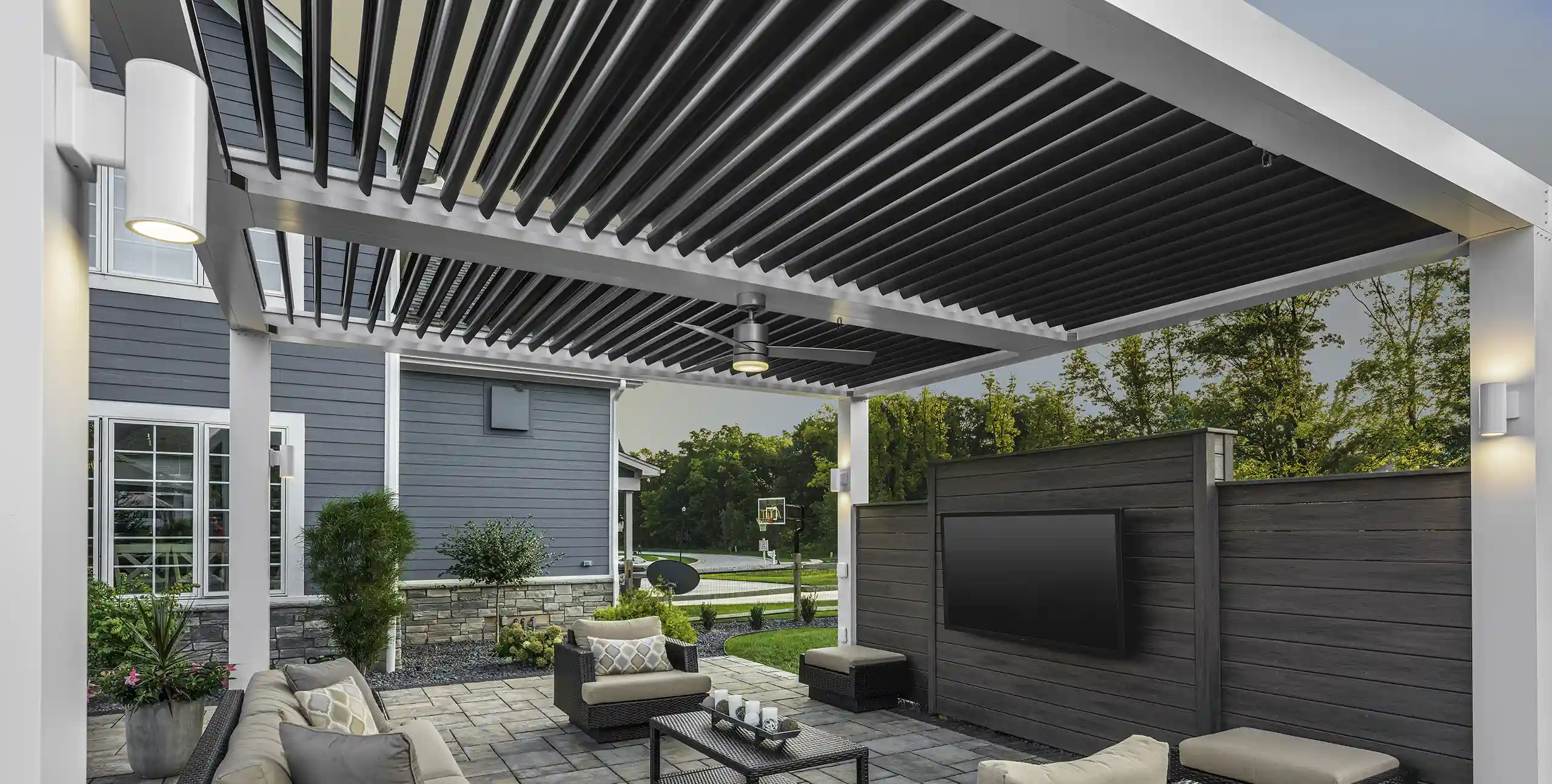 Photo of StruXure Pergola providing cover for a patio with outdoor furniture.
